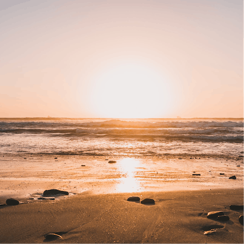 Take a sunset stroll on the beach right on your doorstep