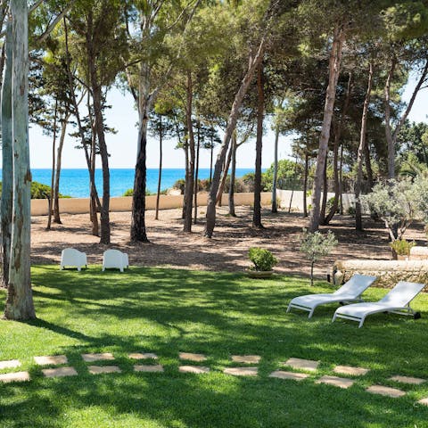 Stretch out on the loungers for a siesta under the trees