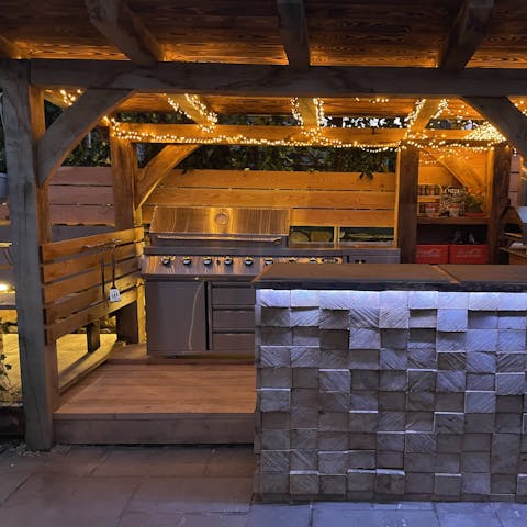 Cook meals outside with the covered BBQ and Pizza oven