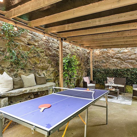 Relax in the shade of the pergola after a game of ping pong
