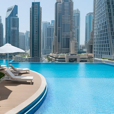 Head up to the communal rooftop pool to relax and enjoy a refreshing swim