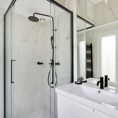 Start mornings with a relaxing soak under the marble-clad bathrooms' rainfall showers