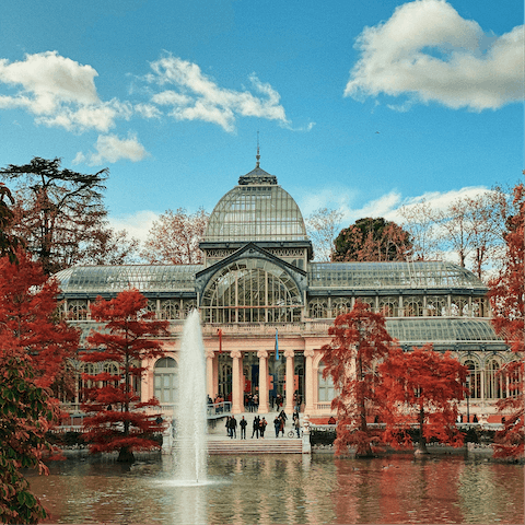 Enjoy a leisurely stroll around Madrid's iconic Retiro Park,  a twenty-minute walk away