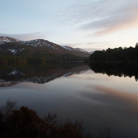 Take in the moody mountain scenery from Loch Alvie, a five-minute walk