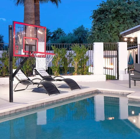 Shoot some hoops from the heated pool