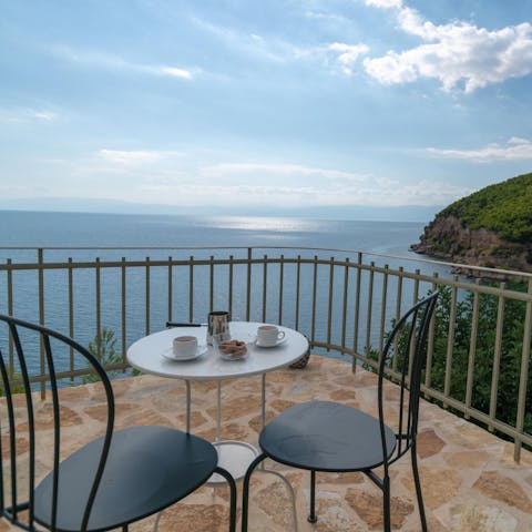 Start your day with a Greek coffee and a panoramic view of the Aegean Sea
