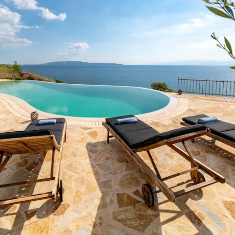 Soak up the views by relaxing on a lounger or swimming in the infinity pool