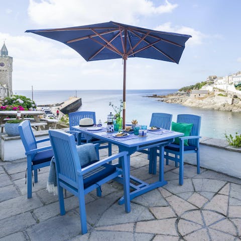 Enjoy a seafood supper on the patio with sweeping harbour views
