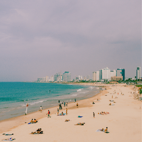 Sink your toes in the sand at Jerusalem Beach, easily reachable on foot