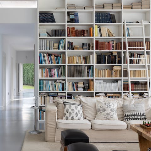 Pick out a book from the expansive home library 