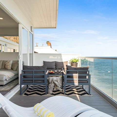 Admire the Pacific Ocean vistas from the private balcony