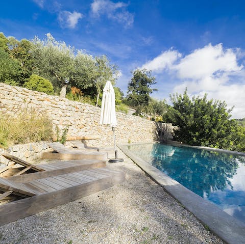 Relax by the pool overlooking the Tramuntana Mountains
