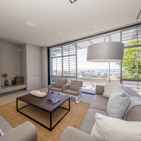 Admire beautiful city views from the comfort of the open-plan living room