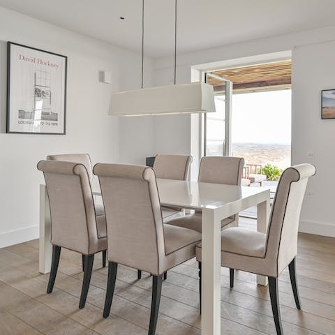 Gather for family meals around the dining table, lovingly prepared in the sleek kitchen