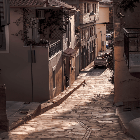 Explore the winding streets and traditional architecture of Kalamata's nearby old town
