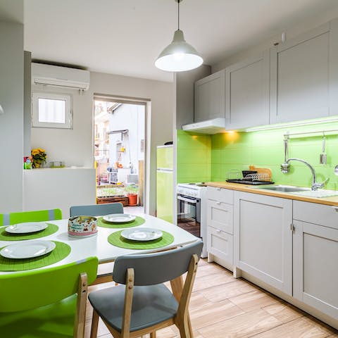 Sit out on the home's patio or enjoy breakfast in the playful lime-green kitchen-dining-room
