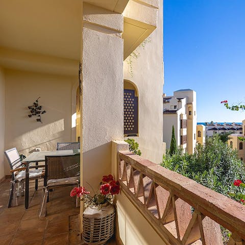 Tuck into Spanish delicacies with a view on the balcony 