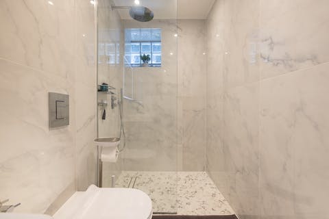 Start mornings off with a luxurious soak in the marble rainfall shower