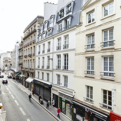 Take in charming views of the Haussmanian architecture across the street from the living room window