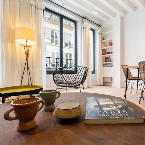 Relax in the open living area with a book in hand after a day of sightseeing in the city of lights