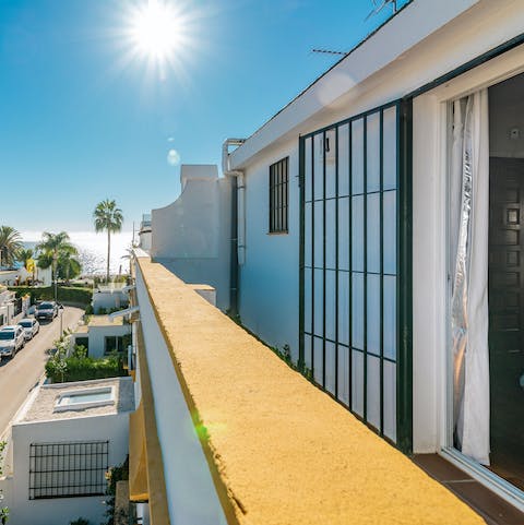 Step out onto the home's balcony and watch the sunlight dance on the Med