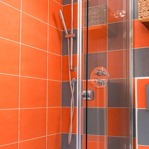 Get ready in the brightly tiled bathroom
