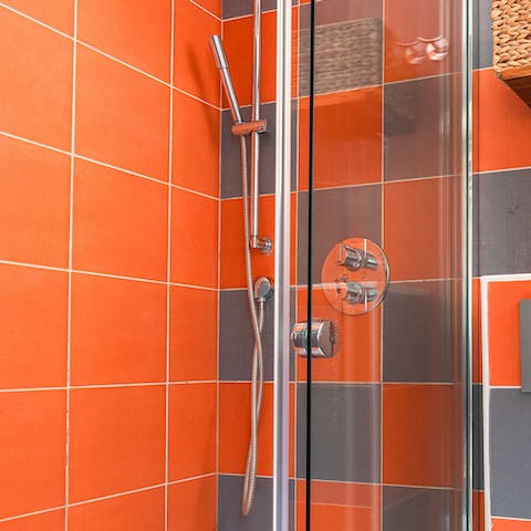 Get ready in the brightly tiled bathroom