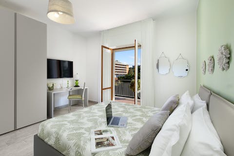 Wake up to immediate outdoor access and work remotely from your bedroom