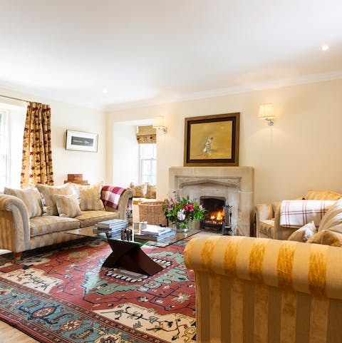 Snuggle up in the cosy living room next to the fire