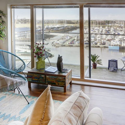 Relax in the comfy chairs with a view of the marina 