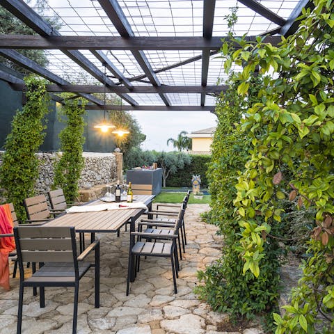 Enjoy languorous dinners underneath the leafy pergola