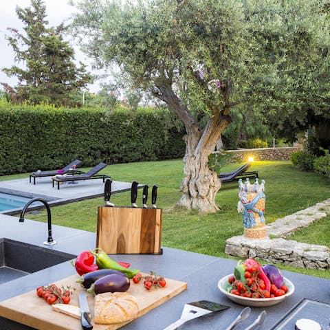 Try your hand at Sicilian culinary traditions in the impressively equipped outdoor kitchen