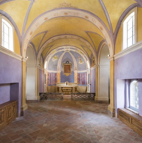 Look up at the painted vaulted ceiling 