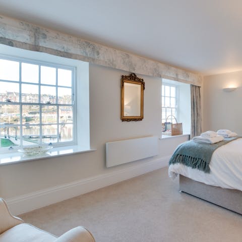 Wake up to views across the water from the comfortable main bedroom