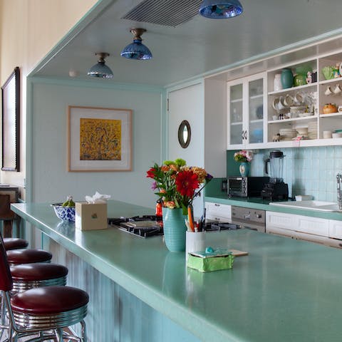 Sit down for a spot of breakfast at the 70s chic kitchen