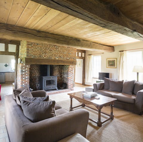 Get cosy in the living room by the fireplace after a day of exploring the Normandy countryside