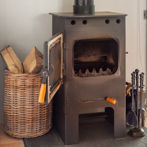 Light the cute wood-burning stove and keep cosy warm