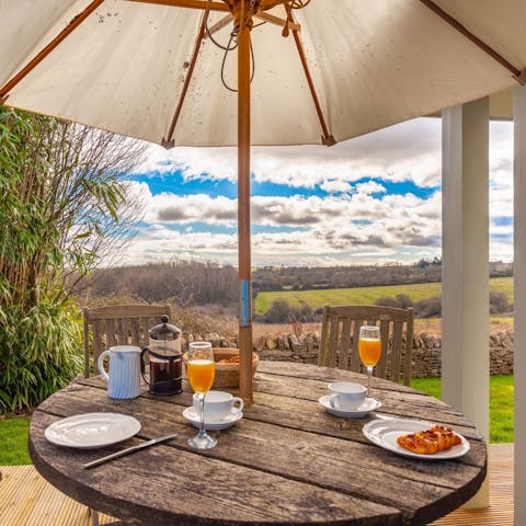 Dine on the decking with an uninterrupted view of the Cotswolds countryside