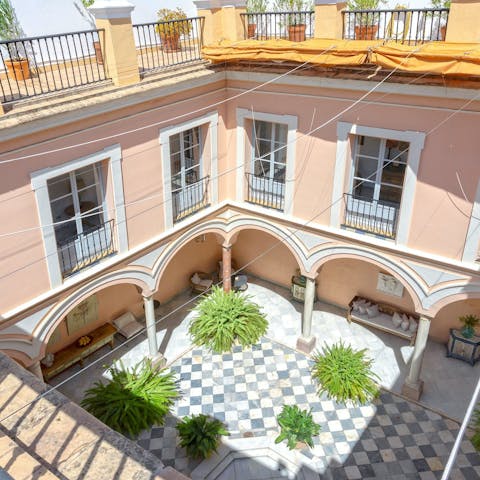 Admire the interior courtyard from this home's balcony