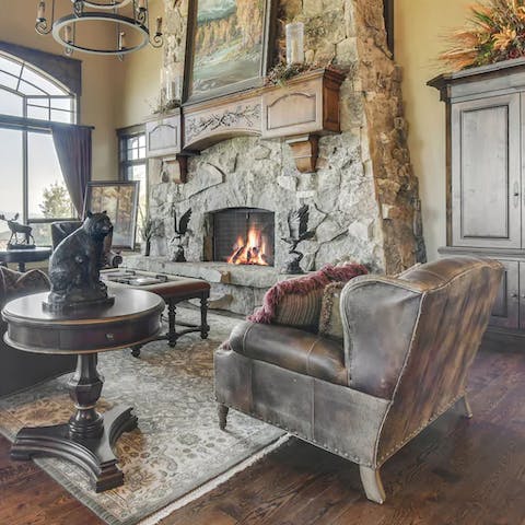 Get a fire roaring in the stone fireplace of the grand living room