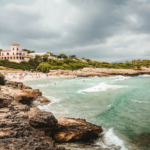 Relax on the white sands of Alcudia Beach, a fifteen-minute drive from this home