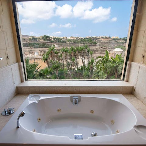 Soak in the spa bath with some incredible views