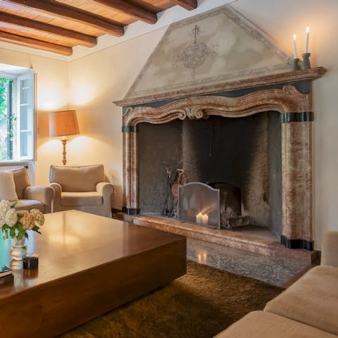 Gather around the old stone fireplace for a cosy evening