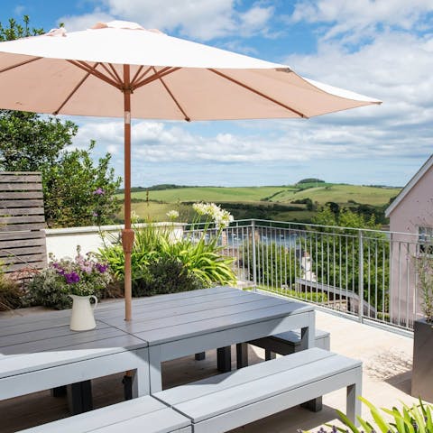 Gaze out over the town harbour from the outdoor dining table