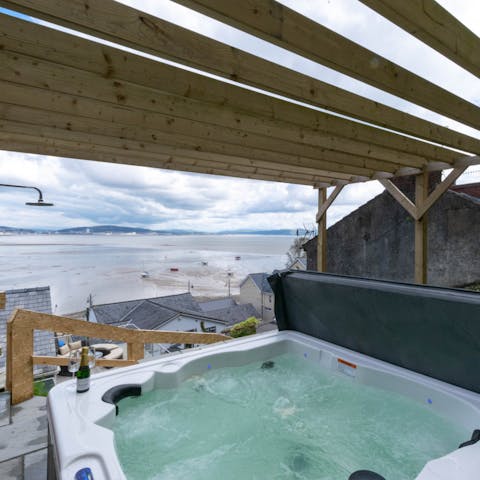 Gaze across the bay from your own private hot tub on the terrace