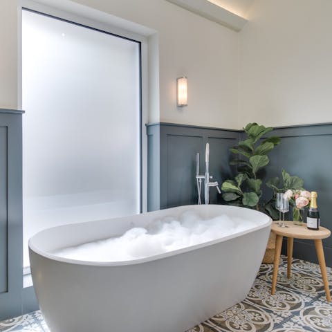 Enjoy a long soak in the freestanding bathtub