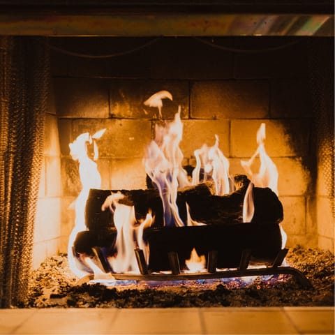 Cosy up around the fire after long days immersing yourself in nature
