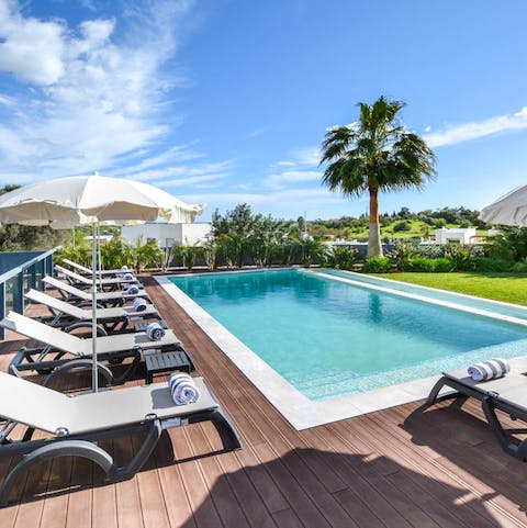 Spend afternoons lounging by the pool and taking refreshing dips in its inviting waters