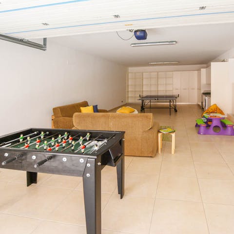 Unleash your competitive side with a game of ping pong or foosball in the games den