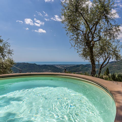 Plunge into the circular pool and gaze out over the hills to the sea